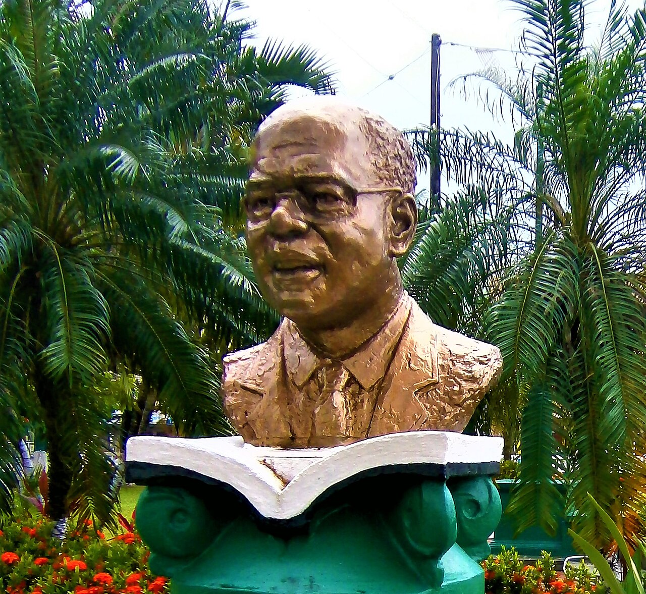 A sculpted portrait of economist Arthur Lewis.