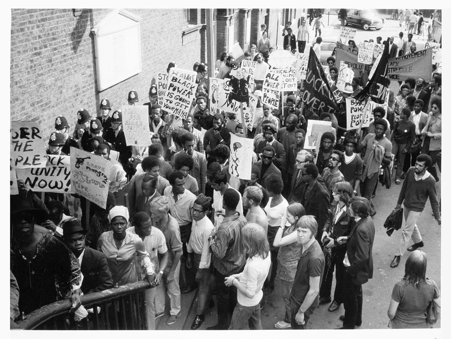 Black-and-white archive photograph showing people taking part in the 1970 march in West London.