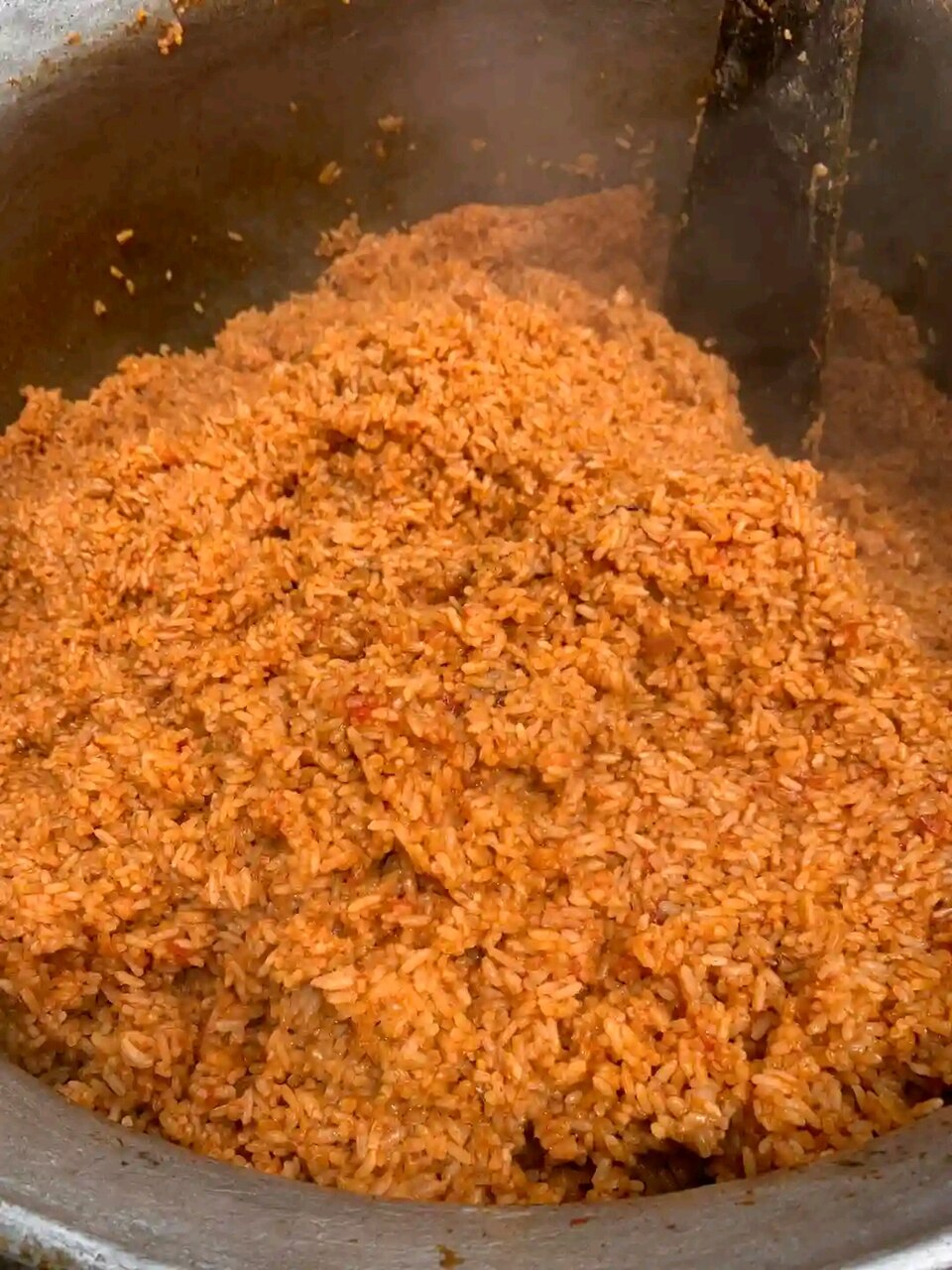 A pot filled with jollof rice.