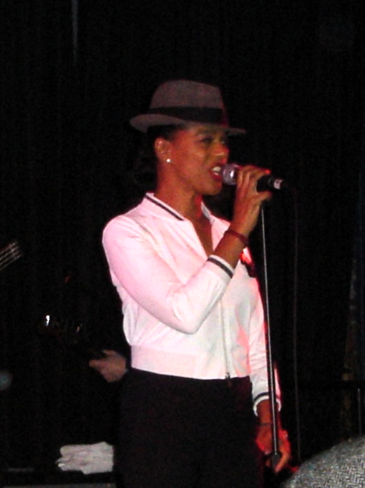 Pauline Black singing with The Selecter on stage in San Francisco.