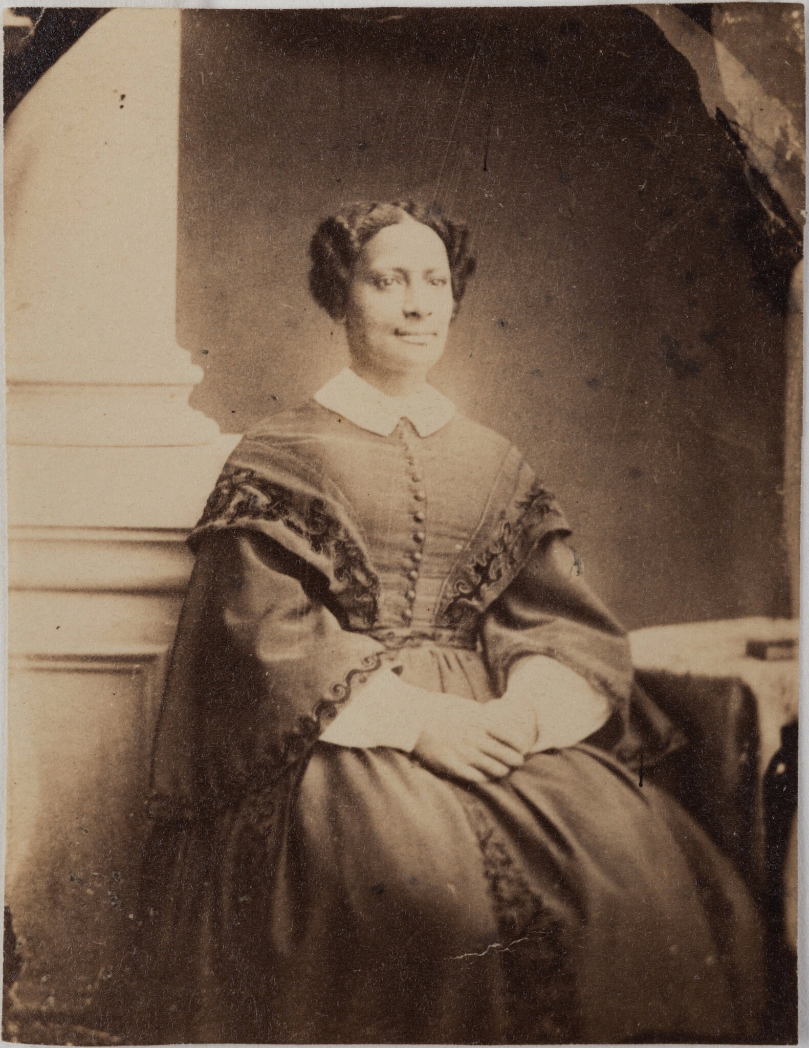 A studio portrait of Sarah Parker Remond wearing a dark dress with a white collar.